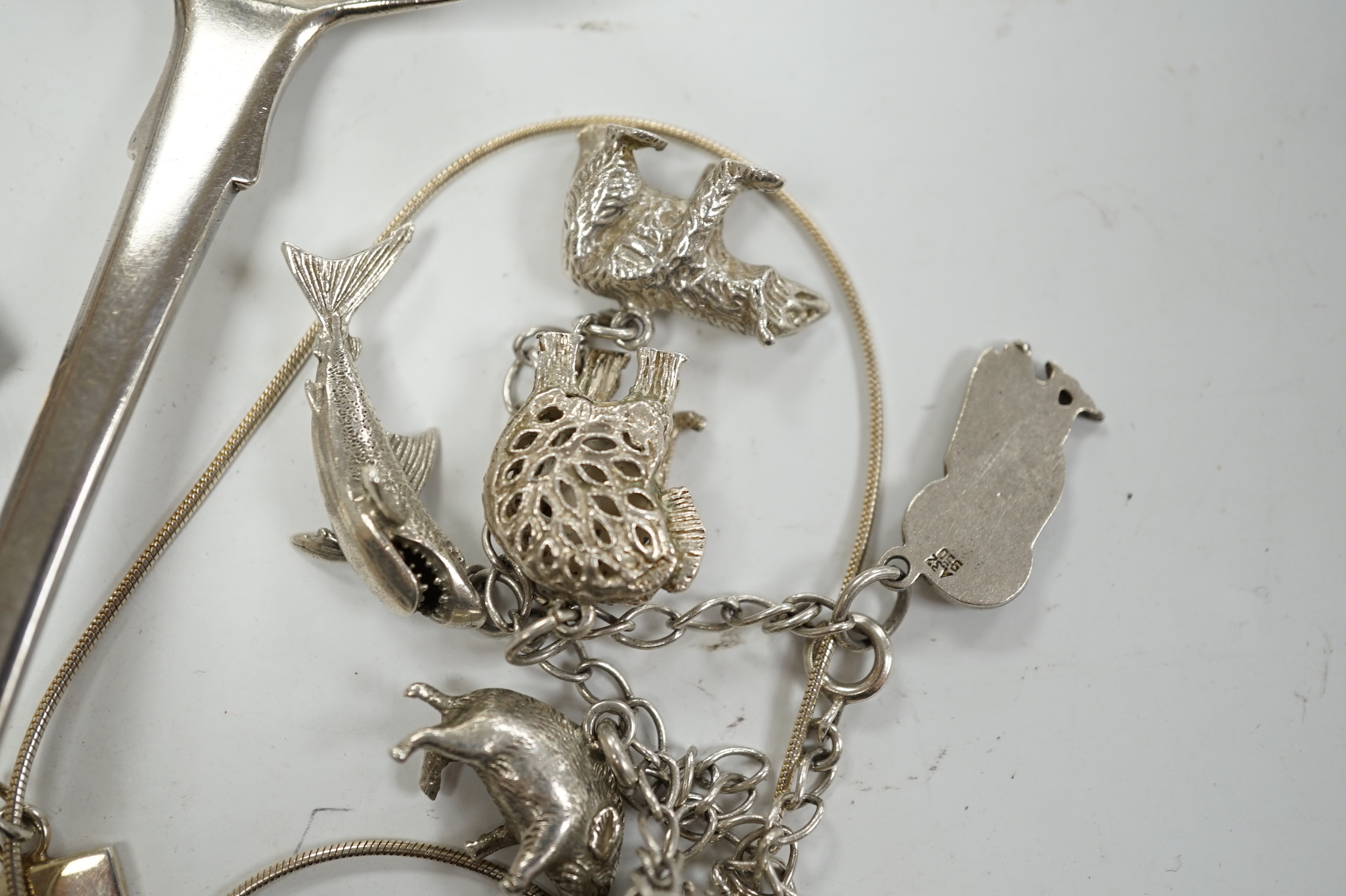 A modern silver mounted blue john pendant, by David Scott Walker, 54mm, together with other jewellery including silver ingot pendant, charm bracelet etc. and a George IV silver sifter spoon, William Eaton, London, 1829.